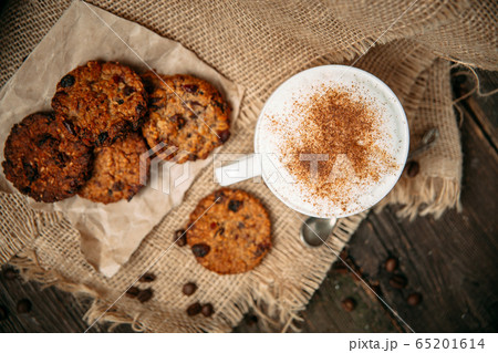 View from above. Coffee on a wooden table. 65201614