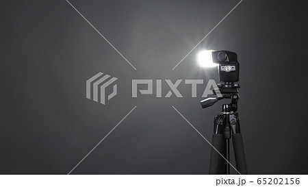 Studio light and back drop and soft box set up for shooting photo or video production which includes flashlight and continue lighting on tripod and paper background and used for photographer Studio light and back drop and soft box set up for shooting photo or video production which includes flashlight and continue lighting on tripod and paper background and used for photographer 65202156