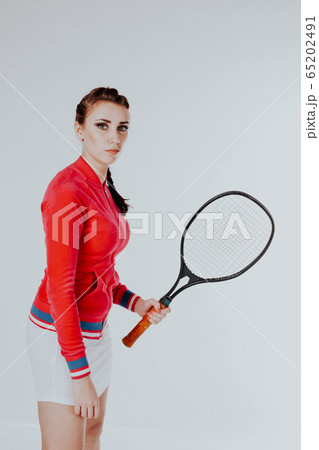 girl playing in the tennis racket sports 65202491