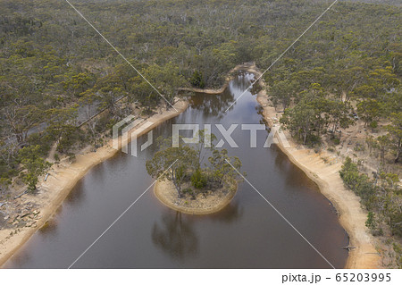 Aerial view of a drought affected water reservoir and small island in rural Australia Aerial view of a drought affected water reservoir and small island in rural Australia 65203995