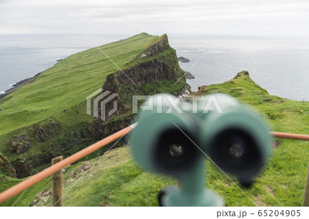 Foggy view of old lighthouse on the Mykines island Foggy view of old lighthouse on the Mykines island 65204905