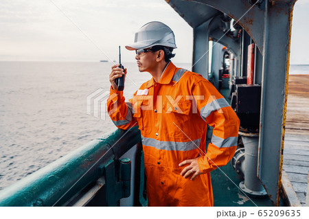 Filipino deck Officer on deck of vessel or ship , wearing PPE personal protective equipment Filipino deck Officer on deck of vessel or ship , wearing PPE personal protective equipment 65209635