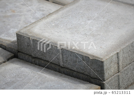 Save Download Preview Stack of gray paving slabs. Laying the sidewalk of the tiles. Construction of sidewalks. Building materials for the construction of the sidewalk. Save Download Preview Stack of gray paving slabs. Laying the sidewalk of the tiles. Construction of sidewalks. Building materials for the construction of the sidewalk. 65213311