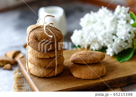 Homemade oatmeal cookies on a wooden cutting board 65215398