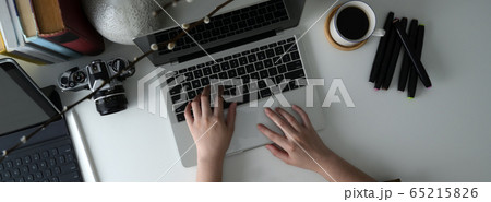 Overhead shot of female freelancer typing on 65215826