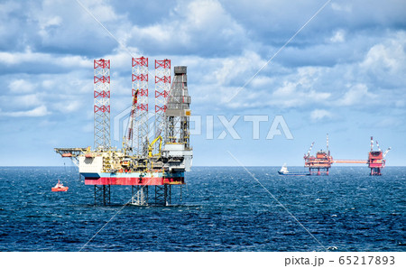 Oil rigs and supply vessels at sea Oil rigs and supply vessels at sea 65217893