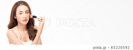 Beauty asian woman  brown hair looking smile in camera happiness and hold make up brush  and cheerful with make up brush,Beauty Concept on white background. 65220592