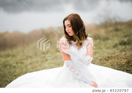 Portrait of a beautiful fashion bride, sweet and sensual. Wedding make up and hair Portrait of a beautiful fashion bride, sweet and sensual. Wedding make up and hair 65220797