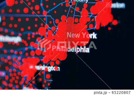 COVID-19 coronavirus pandemic on the US map in close-up with red dots of infection centers. 65220807