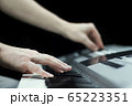 Close up of a man's hands playing and mixing on 65223351
