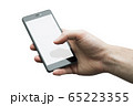Close up of a man's hand holding phone with white 65223355