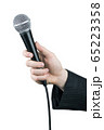 Close up of man's hand holding microphone isolated 65223358