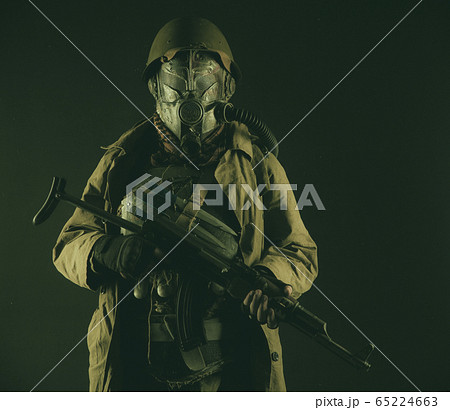 Post apocalyptic soldier aiming firearm weapon Post apocalyptic soldier aiming firearm weapon 65224663