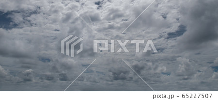Sky with gray cumulus clouds. Wide photo . Sky with gray cumulus clouds. Wide photo . 65227507