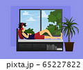 a guy listening to music on sofa bed near window 65227822
