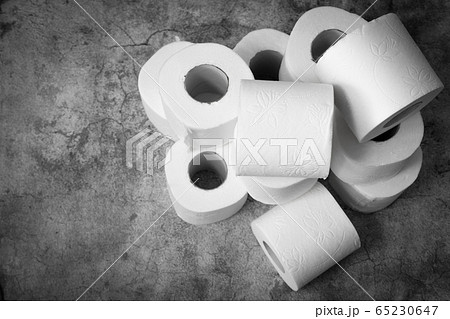 Soft toilet boom yeah rolls for hygiene personnel on a gray background. Stock of basic hygiene products in case of spread of coronavirus, bacteria or germs Soft toilet boom yeah rolls for hygiene personnel on a gray background. Stock of basic hygiene products in case of spread of coronavirus, bacteria or germs 65230647