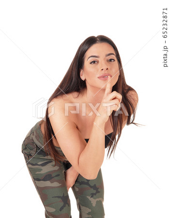 Woman holding finger over her mouth do not talk Woman holding finger over her mouth do not talk 65232871