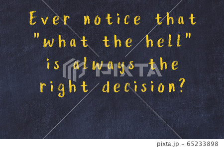 Chalk inscription of smart quote on black desk Chalk inscription of smart quote on black desk 65233898