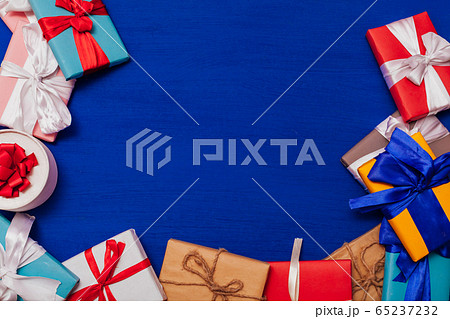 Multi-colored gifts on the birthday party background for inscriptions Multi-colored gifts on the birthday party background for inscriptions 65237232