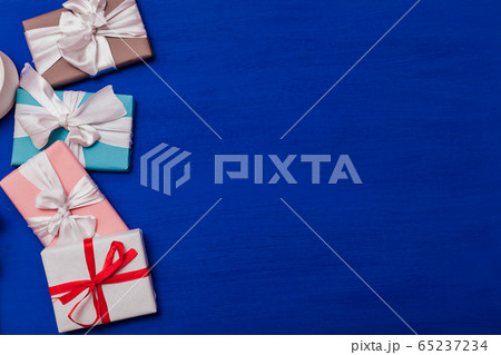 Multi-colored gifts on the birthday party background for inscriptions Multi-colored gifts on the birthday party background for inscriptions 65237234