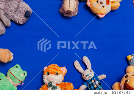 Lots of children's toys for child development games on a blue background Lots of children's toys for child development games on a blue background 65237249