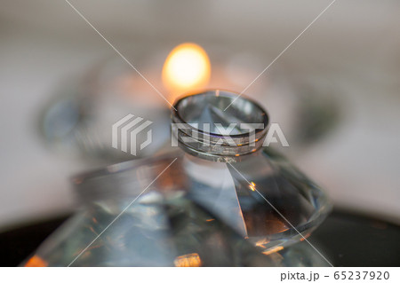 Wedding rings on a diamond shaped crystal background Wedding rings on a diamond shaped crystal background 65237920