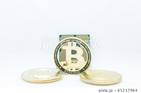 Closeup of physical bitcoin and computer cpu processor 65237964