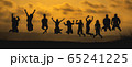 The black silhouette of a large group of people 65241225