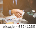Two confident business man shaking hands 65241235