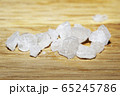 Sea salt on wooden surface. Refined salt, close-up 65245786