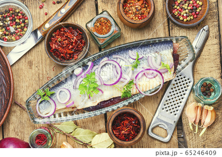 Salted herring on a wooden table 65246409