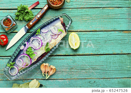 salted herring in fish plate 65247526
