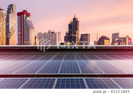 Solar Panel Photovoltaic installation on a Roof of factory, sunny blue sky background, alternative electricity source - Sustainable Resources Concept. Solar Panel Photovoltaic installation on a Roof of factory, sunny blue sky background, alternative electricity source - Sustainable Resources Concept. 65251893