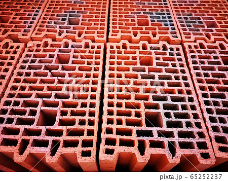 Red bricks with holes background and texture Red bricks with holes background and texture 65252237