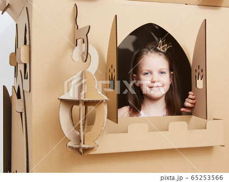 The princess play with cardboard castle tower. The princess play with cardboard castle tower. 65253566