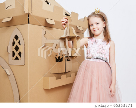 The princess play with cardboard castle tower. 65253571
