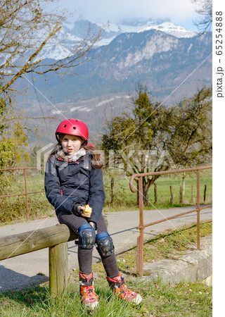 preteen with roller skate helmet, eat an apple preteen with roller skate helmet, eat an apple 65254888