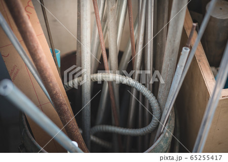 A pipeline and rusty metal line in the workshop. 65255417