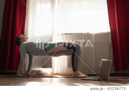 woman practices yoga asana purvottanasana or upward facing plank full pose woman practices yoga asana purvottanasana or upward facing plank full pose 65256773