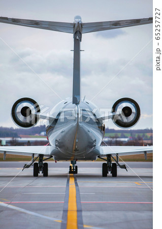 Rear view of airplane taking off in airport Rear view of airplane taking off in airport 65257727