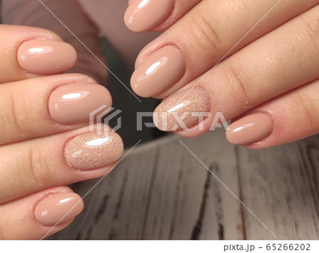 Closeup photo of a beautiful female hands with 65266202