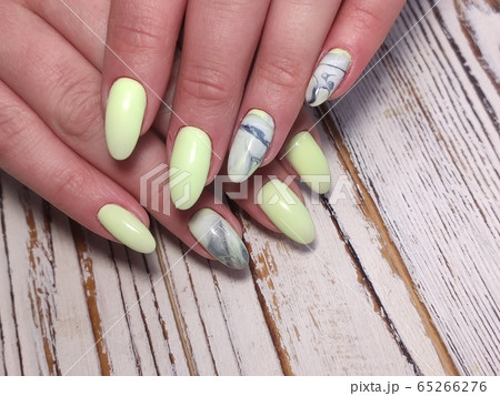 Closeup photo of a beautiful female hands with 65266276