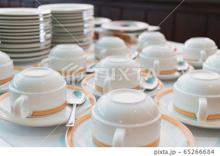 Group of ceramic cup and plates stacked on the table for tea or coffee service 65266684