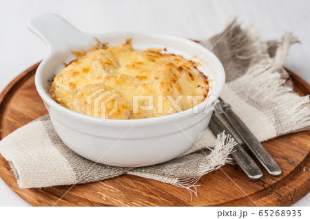 Potato gratin with herbs in batch form Potato gratin with herbs in batch form 65268935