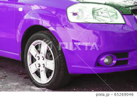 Wing, wheel and car headlight bright color, close-up Wing, wheel and car headlight bright color, close-up 65269046