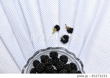 Half a round crystal vase with fresh blackberries Half a round crystal vase with fresh blackberries 65273233