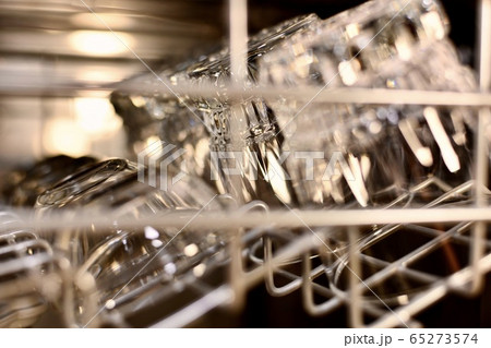 Transparent shiny glasses and cups on a lattice Transparent shiny glasses and cups on a lattice 65273574