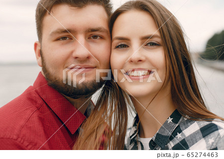Beautiful couple spend time in a summer park 65274463