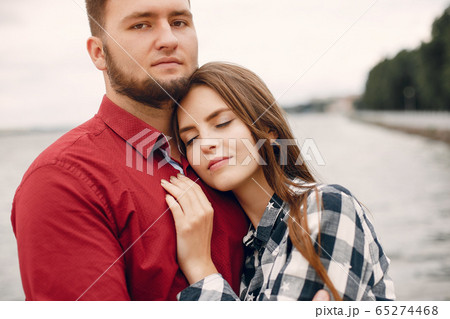 Beautiful couple spend time in a summer park 65274468