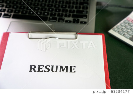 Closeup of resume on top of computer laptop on Closeup of resume on top of computer laptop on 65284177